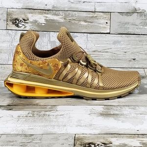nike shox gravity women's gold